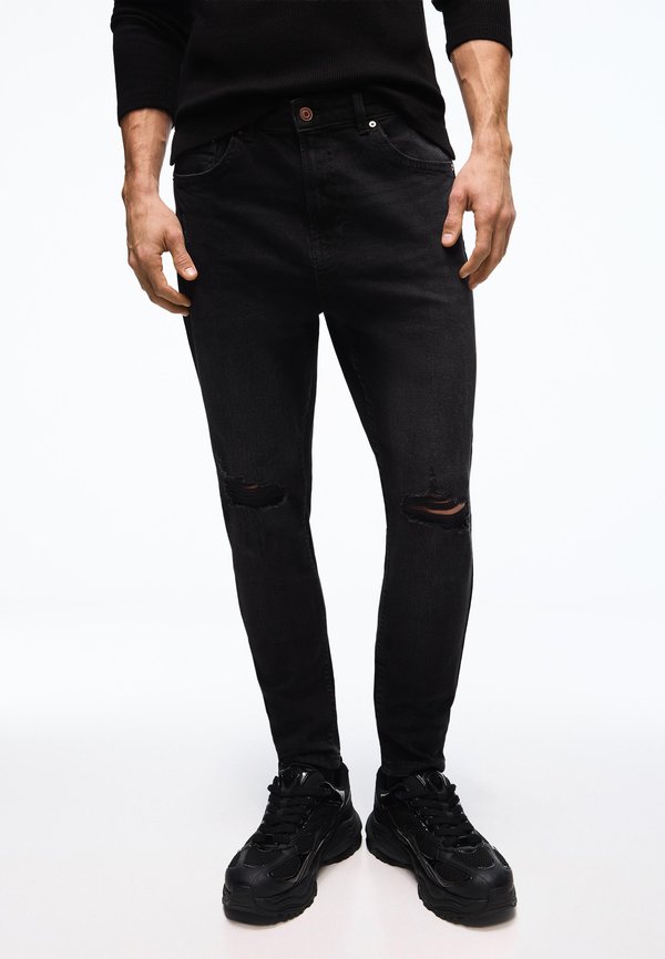 Bershka CARROT DESTROY - Slim fit jeans - black