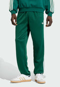 adidas Originals REGULAR FIT - Tracksuit bottoms - collegiate green