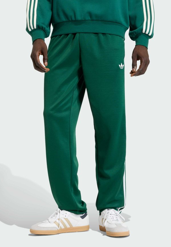 adidas Originals REGULAR FIT - Tracksuit bottoms - collegiate green