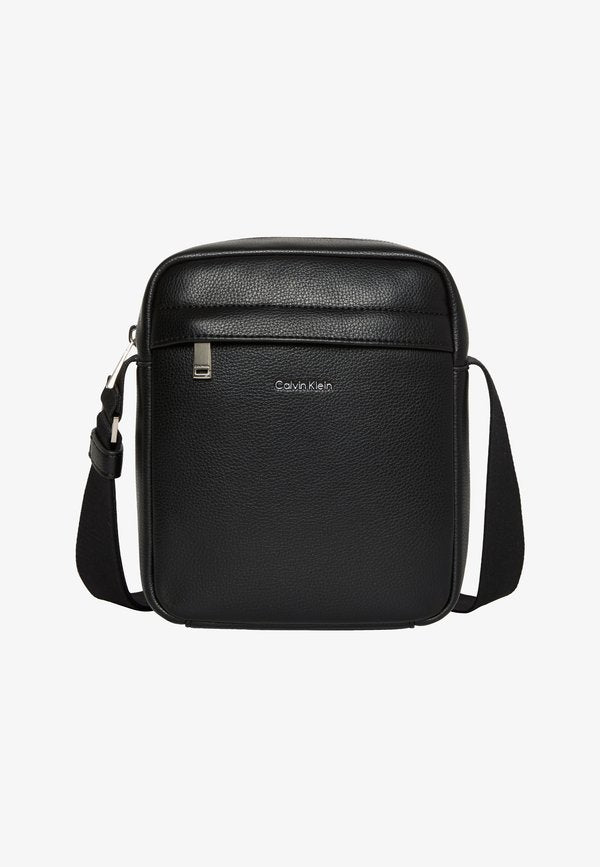 Calvin Klein RAISED REPORTER - Cross body bag - black
