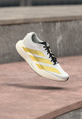 adidas Performance ADIZERO EVO SL WOVEN M - Trainers - footwear white/matte gold-coloured/core black