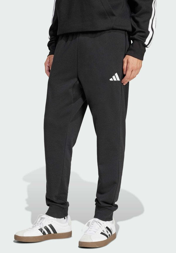 adidas Sportswear ESSENTIALS FEEL COZY - Tracksuit bottoms - black white