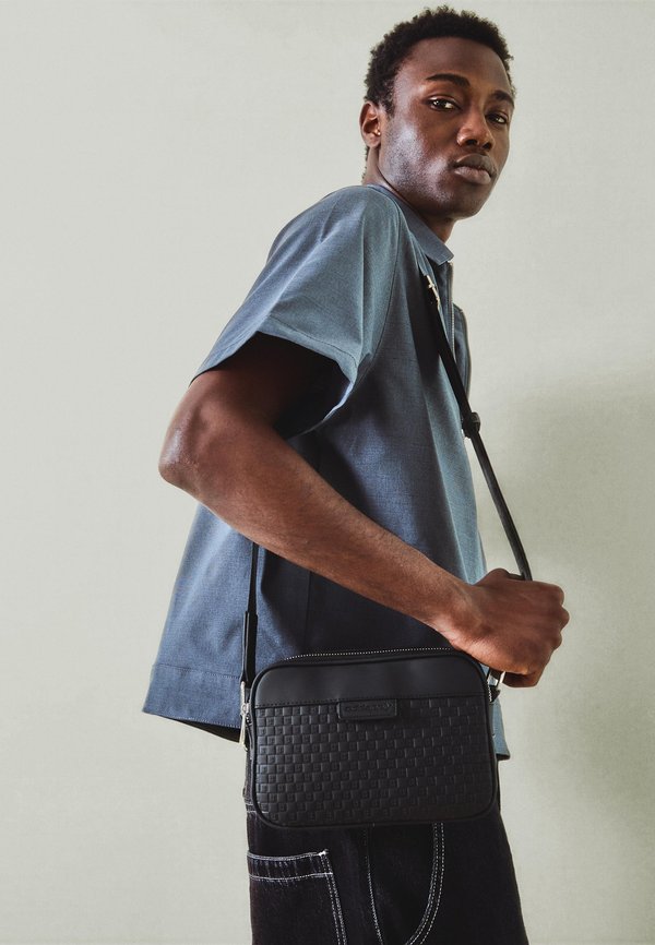 Bershka MONOGRAM EMBOSSED  - Cross body bag - black