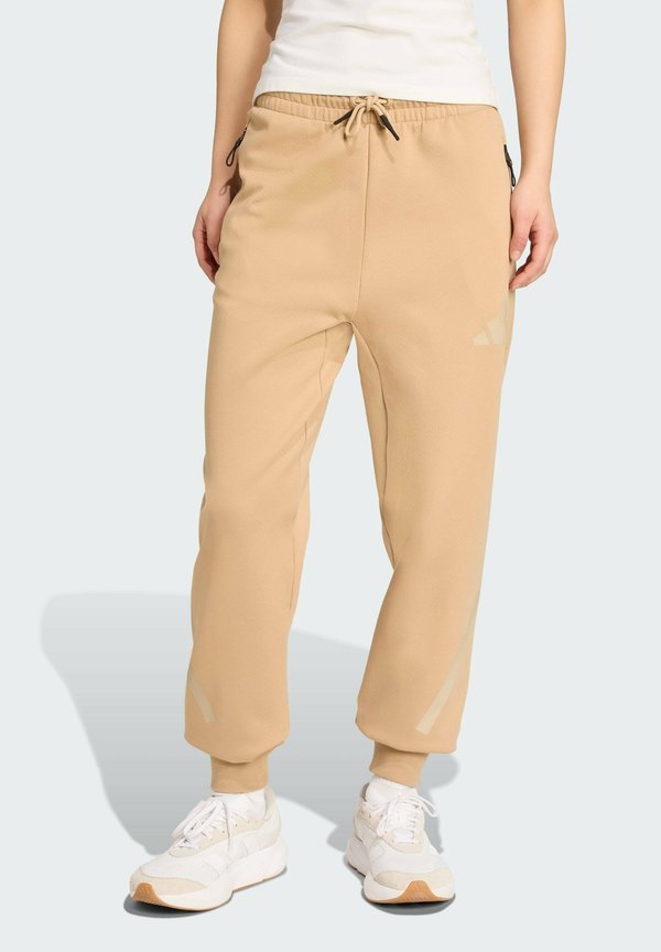 adidas Sportswear ADIDAS Z.N.E. - Tracksuit bottoms - warm sandstone