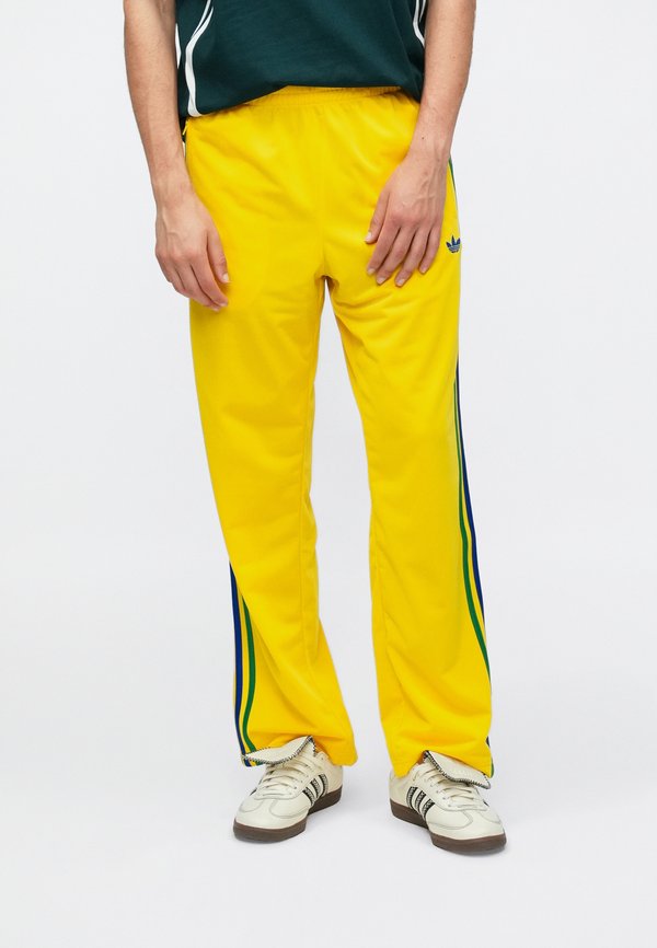 adidas Originals FIREBIRD TP - Tracksuit bottoms - yellow