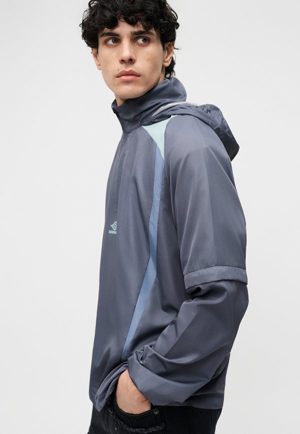 Umbro ZIP OFF SLEEVE WIND JACKET