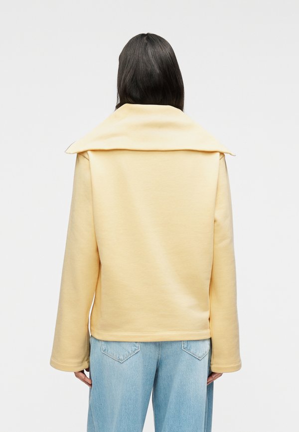 KARL LAGERFELD SIGNATURE HEM HALF ZIP UP