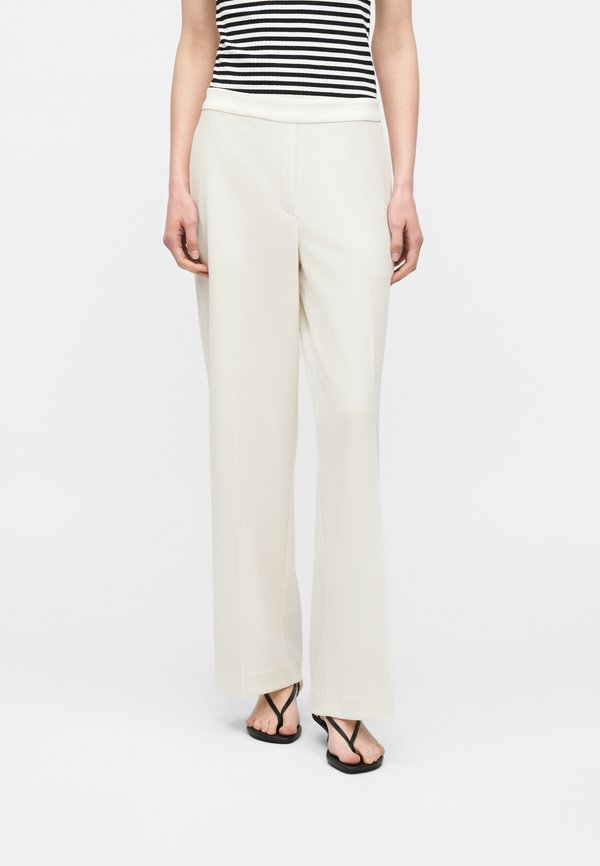 Calvin Klein TRAVEL PANT - Trousers - tofu